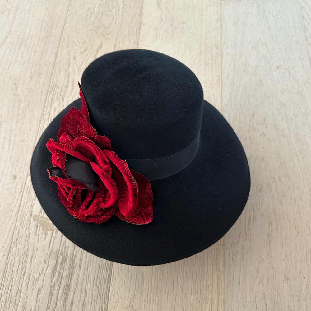 Elegant Black Hat with Red Floral Accent